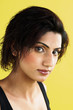 Studio shot of a short haired lady looking at the camera