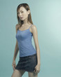 Studio shot of a lady in blue spaghetti top and mini skirt