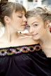 A woman resting her chin on her partner's shoulder