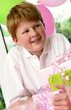 A boy sitting in front of the presents