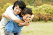 Photo: Adult daughter carrying mother on her back Adult daughter carrying mother on her back