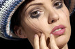 Close-up picture of a smudged eye shadow on a woman's face 