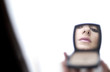 Foto: Mirror reflection of a woman's face Mirror reflection of a woman's face