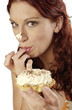Woman eating a creamy tart 