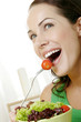Woman holding a bowl of salad