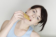 Woman eating biscuit