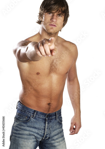 Photo: Shirtless muscular man pointing at the camera Shirtless muscular man pointing at the camera