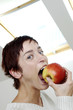 Woman biting an apple
