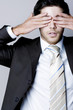 Photo: Businessman closing his eyes with his hands Businessman closing his eyes with his hands