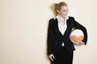 Businesswoman holding a ball