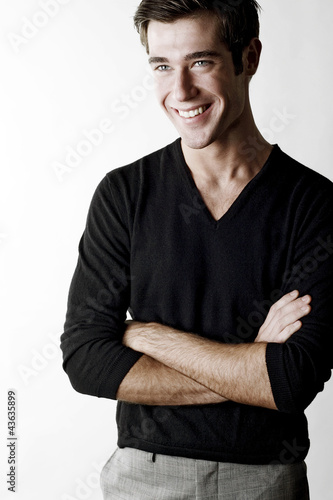 Photo: Man folding his arms while smiling Man folding his arms while smiling