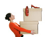 Businesswoman carrying boxes with her high heels on top