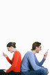 Man and woman screaming into their cell phones