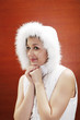 Woman in winter clothing looking at the camera