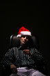 Foto: Businessman with Christmas hat smoking cigarette Businessman with Christmas hat smoking cigarette