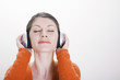 Woman listening to music on the headphones