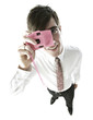 Businessman taking picture with his camera