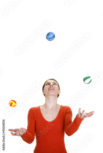 Photo: Woman juggling with three balls Woman juggling with three balls