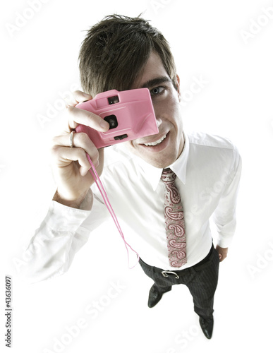 Photo: Businessman taking picture with his camera Businessman taking picture with his camera
