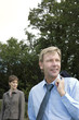 Businessman and woman in the park