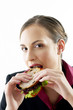 Businesswoman eating a sandwich