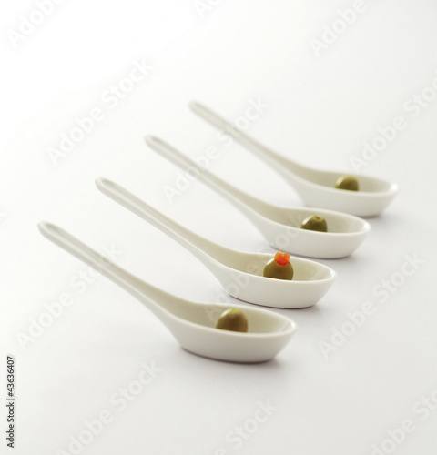 Photo: Olives in spoon Olives in spoon