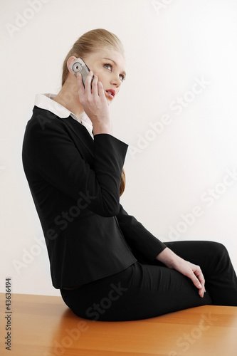 Photo: Businesswoman talking on the phone Businesswoman talking on the phone