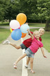 Children having fun with balloons