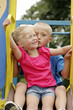 Boy kissing girl on the cheeks
