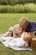 Boy whispering into girl's ear