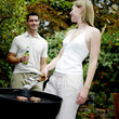 Couple grilling food in the park