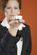 Businesswoman holding a lit candle