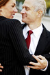 Businessman and businesswoman dancing together