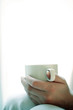 Hand holding a cup of coffee