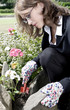 Businesswoman gardening in the park