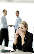 Businesswoman yawning while talking on the phone