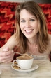 A teenage girl enjoying her cappuccino