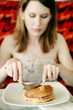 A teenage girl having her breakfast in the cafe