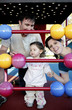 Parents and daughter playing with abacus in the playground