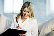 A business lady writing happily