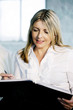 A business lady writing
