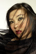 Woman in black with black shawl
