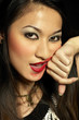 Photo: Woman rubbing off her lipstick with her hand Woman rubbing off her lipstick with her hand
