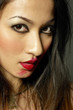 Photo: Woman with red lipstick smudged around her lips Woman with red lipstick smudged around her lips