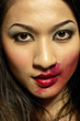 Photo: Woman with red lipstick smudged around her lips Woman with red lipstick smudged around her lips