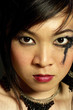 Photo: Angry woman with mascara smudged around her eye Angry woman with mascara smudged around her eye