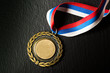 Metal medal with tricolor ribbon