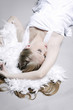 Young woman in white posing for the camera