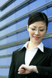 Businesswoman checking the time on her watch