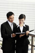 Businessman and businesswoman having discussion